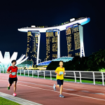 **

"A diverse group of marathon runners, fully clothed in athletic wear, running through downtown Singapore at night, with the Marina Bay Sands and Gardens by the Bay illuminated in the background, safe for work, appropriate content, professional athletes, perfect anatomy, correct proportions, well-formed hands, natural body proportions, high quality, professional photography, family-friendly."

**